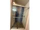 Modern walk-in shower featuring blue tile, pebble floor and glass doors at 13244 Doral Ave, Port Charlotte, FL 33953