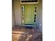 Charming home entrance featuring a green front door and a brick-paved porch at 13244 Doral Ave, Port Charlotte, FL 33953