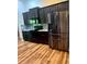 Modern kitchen with sleek black appliances, stylish cabinetry, and granite countertops at 13244 Doral Ave, Port Charlotte, FL 33953