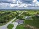 Spacious home featuring a circular driveway, attached two car garage, and landscaping in an open natural setting at 13252 Keystone Blvd, Port Charlotte, FL 33981