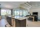 Well-appointed kitchen with granite island, stainless steel appliances, and an open design to the living area at 13252 Keystone Blvd, Port Charlotte, FL 33981