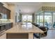 Spacious kitchen featuring granite countertops, dark cabinetry, and stainless-steel appliances with an open layout at 13252 Keystone Blvd, Port Charlotte, FL 33981