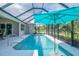 Inviting pool with clear water, surrounded by a screened enclosure and ample space for relaxation at 13252 Keystone Blvd, Port Charlotte, FL 33981
