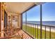 Inviting balcony offers picturesque views of the sandy beach and bay at 14459 River Beach Dr # 122, Port Charlotte, FL 33953