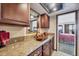 Bathroom with elegant granite countertops, stylish vessel sink, and dark wooden cabinetry at 14459 River Beach Dr # 122, Port Charlotte, FL 33953