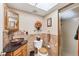 Elegant bathroom featuring a stylish vessel sink, decorative mirror, and a glass-enclosed shower at 14459 River Beach Dr # 122, Port Charlotte, FL 33953