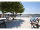Enjoy relaxing at the beach under the shade with the provided beach seating with waterfront views at 14459 River Beach Dr # 122, Port Charlotte, FL 33953