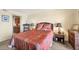 Bedroom featuring stylish bed decor, ample space, furnishings, and an interior view to the bath at 14459 River Beach Dr # 122, Port Charlotte, FL 33953
