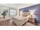 Cozy bedroom featuring a comfortable bed, nightstands with lamps, and neutral tones at 14459 River Beach Dr # 122, Port Charlotte, FL 33953