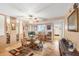 The dining room features a glass table, wicker chairs, and mirrors to expand the space at 14459 River Beach Dr # 122, Port Charlotte, FL 33953