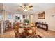 Open dining room featuring a glass-top table, cushioned seating, and decorative accents at 14459 River Beach Dr # 122, Port Charlotte, FL 33953