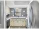 A well-kept kitchen with white cabinets, neutral countertops, and stainless steel appliances at 14459 River Beach Dr # 122, Port Charlotte, FL 33953