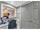 Office work space area inside the home with natural light, desk, chair, and storage space at 14459 River Beach Dr # 122, Port Charlotte, FL 33953