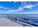 A white wooden pier offers stunning water views, great for fishing and relaxing by the sea at 14459 River Beach Dr # 122, Port Charlotte, FL 33953