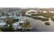 Stunning aerial view of waterfront homes, situated on a scenic canal at 1490 Janet Pl, Englewood, FL 34223