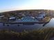 Aerial view of the house on a canal with a long, private backyard at 1490 Janet Pl, Englewood, FL 34223