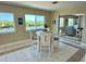 Bright dining area with waterfront views, perfect for enjoying meals with a scenic backdrop at 1490 Janet Pl, Englewood, FL 34223