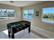Entertaining game room with foosball table and scenic water views at 1490 Janet Pl, Englewood, FL 34223