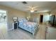 Spacious main bedroom featuring a ceiling fan, and an ensuite bath at 1490 Janet Pl, Englewood, FL 34223