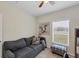 Neutral office with sofa, window with blinds, and decorative cow art at 15613 Alsask Cir, Port Charlotte, FL 33981