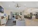 Spacious living room with tile floors, ceiling fan, vaulted ceilings and combined with a well-appointed kitchen at 15613 Alsask Cir, Port Charlotte, FL 33981