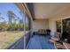 Comfortable screened patio for outdoor living with nice green view at 15613 Alsask Cir, Port Charlotte, FL 33981