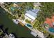 Waterfront home featuring a private dock with boat lift and backyard pond at 1648 Shelburne Ln, Sarasota, FL 34231