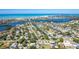 Expansive aerial view of waterfront homes and canal in a coastal community with ocean views and city skyline at 1648 Shelburne Ln, Sarasota, FL 34231