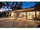 Inviting back patio with tiled flooring and glass doors leading to the home's interior at 1648 Shelburne Ln, Sarasota, FL 34231
