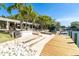 Extensive backyard space with access to a dock and waterfront, surrounded by lush greenery and mature trees at 1648 Shelburne Ln, Sarasota, FL 34231