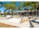 Spacious backyard with a patio, steps down to waterfront and dock, enhancing outdoor living and entertainment at 1648 Shelburne Ln, Sarasota, FL 34231