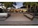 Spacious backyard with steps leading to patio, perfect for outdoor activities and relaxation at 1648 Shelburne Ln, Sarasota, FL 34231
