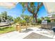 The spacious backyard patio has a outdoor kitchen, grill, and boat dock, making it perfect for entertaining and enjoying waterfront views at 1648 Shelburne Ln, Sarasota, FL 34231
