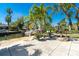 Patio with a water view, firepit, and grill at 1648 Shelburne Ln, Sarasota, FL 34231