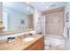 Inviting bathroom with granite countertop, updated fixtures, and soaking tub at 1648 Shelburne Ln, Sarasota, FL 34231