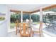 Bright dining room with many windows looking out on patio and backyard at 1648 Shelburne Ln, Sarasota, FL 34231
