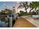 Scenic view of the dock area with a boat, highlighting the waterfront lifestyle and boating opportunities at 1648 Shelburne Ln, Sarasota, FL 34231