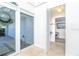 Bright foyer with views of the front yard and an open door to an office space at 1648 Shelburne Ln, Sarasota, FL 34231