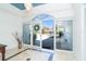 Bright foyer featuring tile floors, high ceilings, and an arched doorway at 1648 Shelburne Ln, Sarasota, FL 34231
