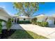 Charming single-story home featuring an attached garage and well-maintained landscaping at 1648 Shelburne Ln, Sarasota, FL 34231