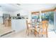 A spacious eat-in kitchen and dining area is connected to the kitchen, featuring lots of windows at 1648 Shelburne Ln, Sarasota, FL 34231