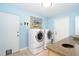 Convenient laundry room with washer, dryer, and counter space at 1648 Shelburne Ln, Sarasota, FL 34231