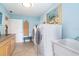 Spacious laundry room with countertop, cabinet storage, and sink at 1648 Shelburne Ln, Sarasota, FL 34231