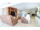 Expansive living room featuring stone fireplace, wood built-ins, and natural light at 1648 Shelburne Ln, Sarasota, FL 34231