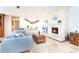 Inviting living room with stone fireplace, travertine floors, and comfortable seating arrangement at 1648 Shelburne Ln, Sarasota, FL 34231
