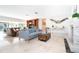 Open concept living space boasts neutral toned tile flooring, fireplace and a cozy seating area at 1648 Shelburne Ln, Sarasota, FL 34231