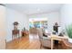 Bright living room with hardwood floors, modern furnishings, and views of the waterfront beyond at 1648 Shelburne Ln, Sarasota, FL 34231