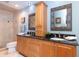 Beautiful ensuite bathroom with double vanity, granite counters, and custom mirrors at 1648 Shelburne Ln, Sarasota, FL 34231