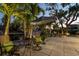 Cozy patio with comfortable seating, umbrella, and waterfront views, ideal for relaxation at 1648 Shelburne Ln, Sarasota, FL 34231