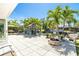 Backyard patio with fire pit, outdoor seating, and waterfront views at 1648 Shelburne Ln, Sarasota, FL 34231
